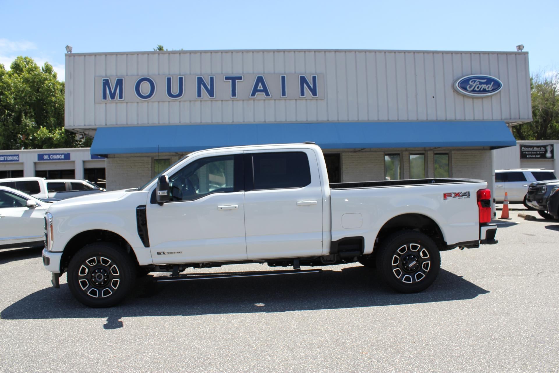 2026 Ford Super Duty F-350 Platinum in Star White Metallic Tri-Coat — front three-quarter view