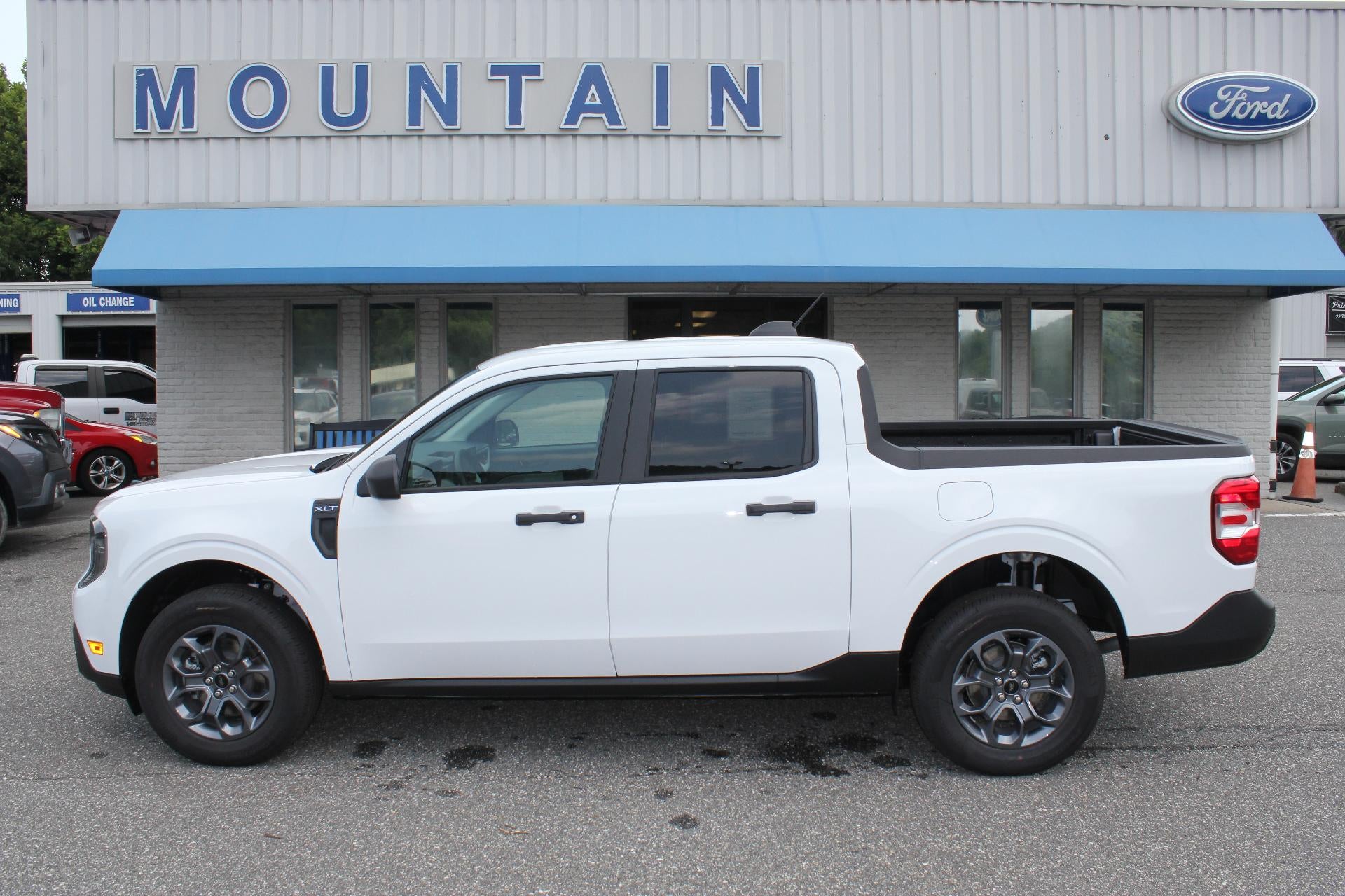 2026 Ford Maverick XLT in Oxford White — front three-quarter view