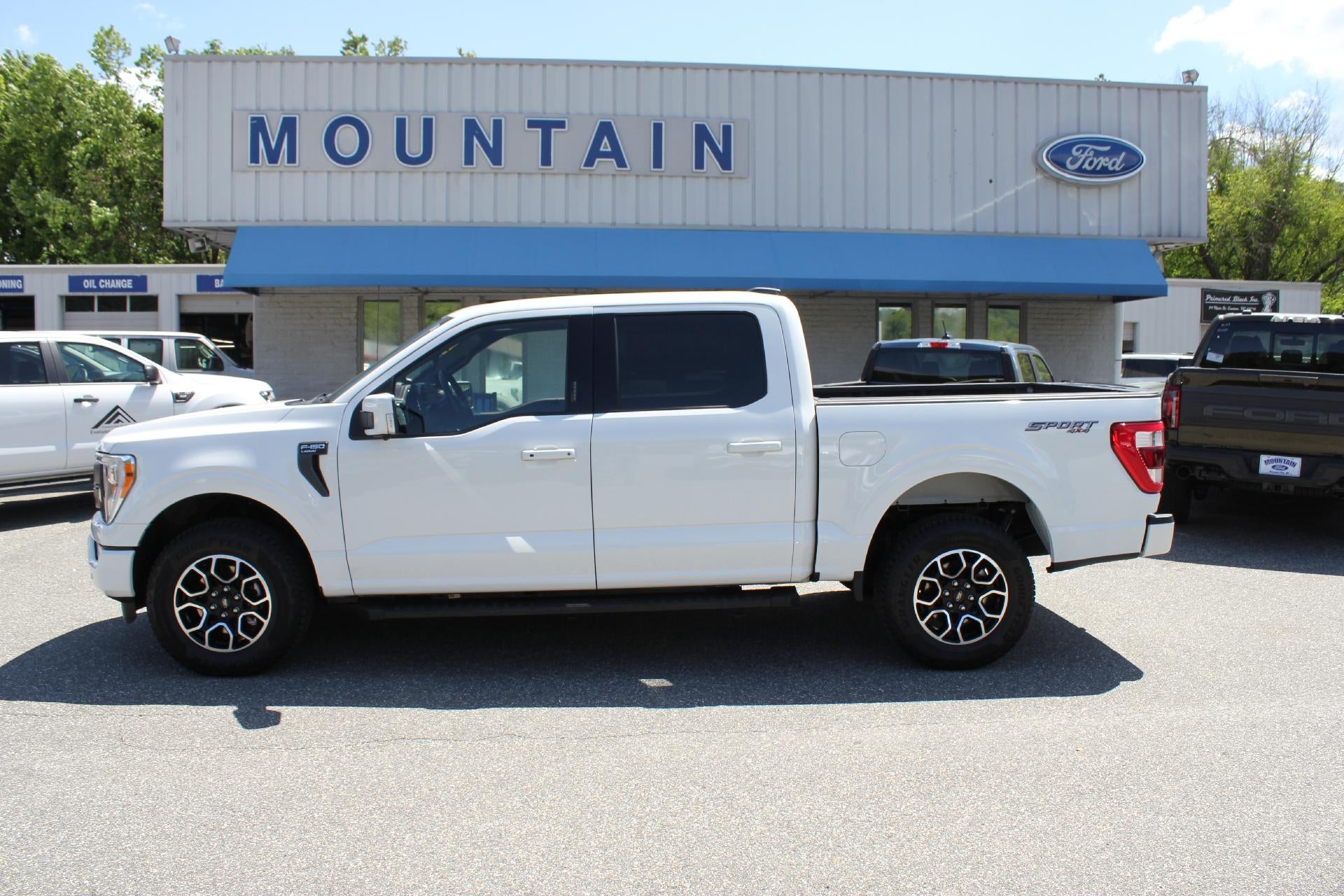 2022 Ford F-150 Lariat in Star White — front three-quarter view