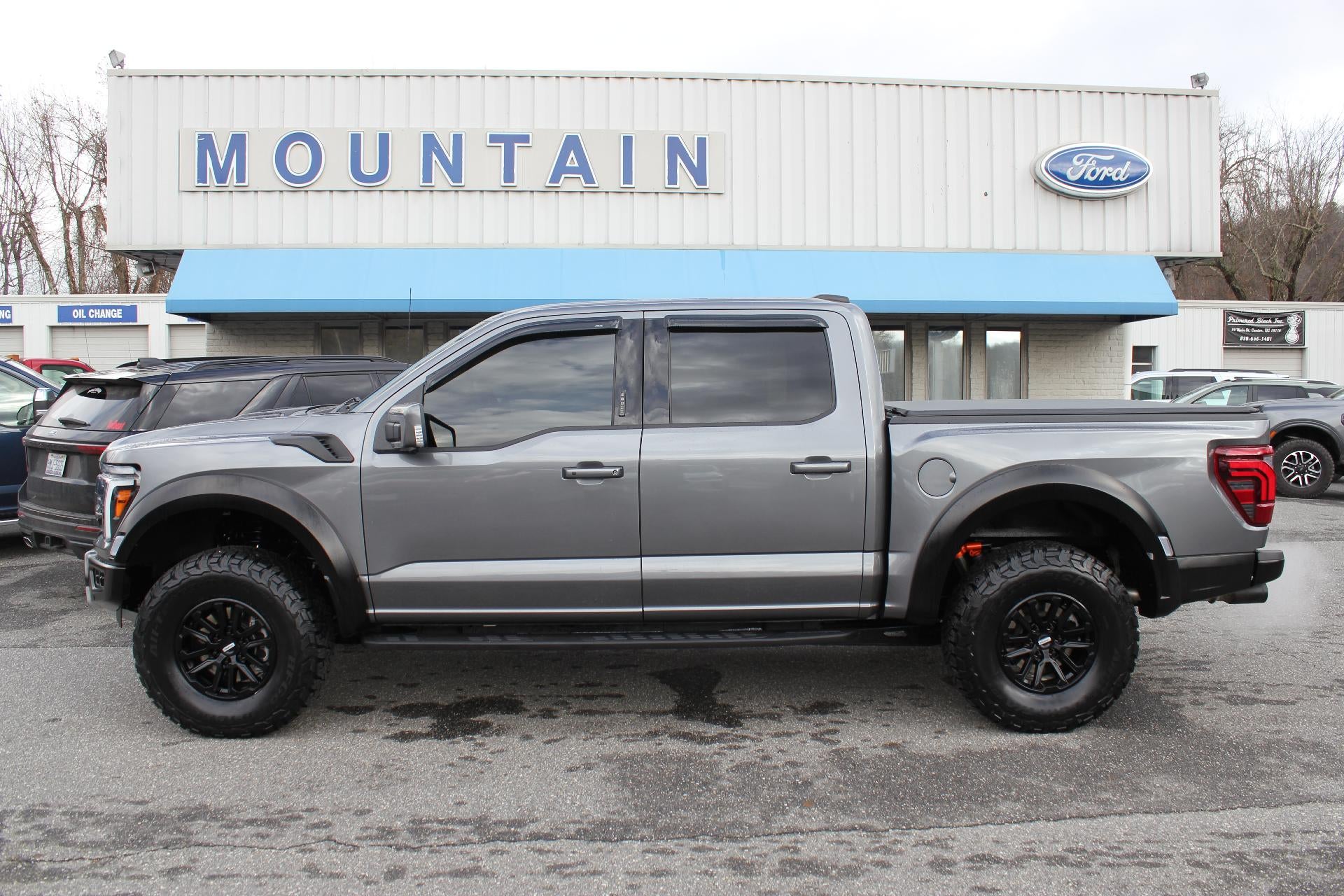 2024 Ford F-150 Raptor in Carbonized — front three-quarter view